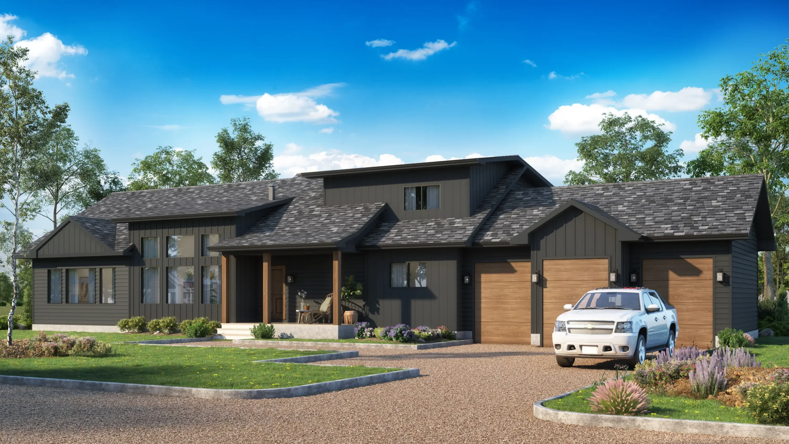 A modern ready-to-move (RTM) home featuring a dark exterior with sleek, charcoal-colored siding and wooden garage doors. The home has a large, gabled roof with varying heights, adding architectural interest. A white pickup truck is parked in the gravel driveway, while the front yard is landscaped with shrubs, flowers, and a well-maintained lawn. The front porch includes a cozy seating area, and large windows allow plenty of natural light into the living space. The home is surrounded by trees and greenery, set against a bright blue sky with light clouds.