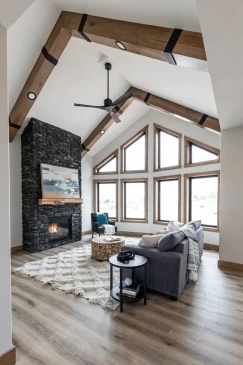 Vaulted ceiling with exposed beams and large feature windows in modern RTM home in Alberta and Saskatchewan