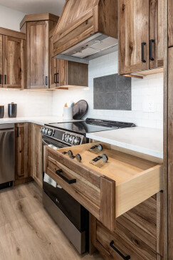 Custom kitchen cabinetry with built-in spice drawer in RTM home in Alberta and Saskatchewan