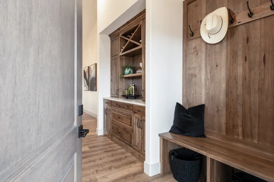 Custom built-in wood cabinetry with wine storage in RTM home entry area